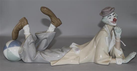 A Lladro recumbent clown with ball